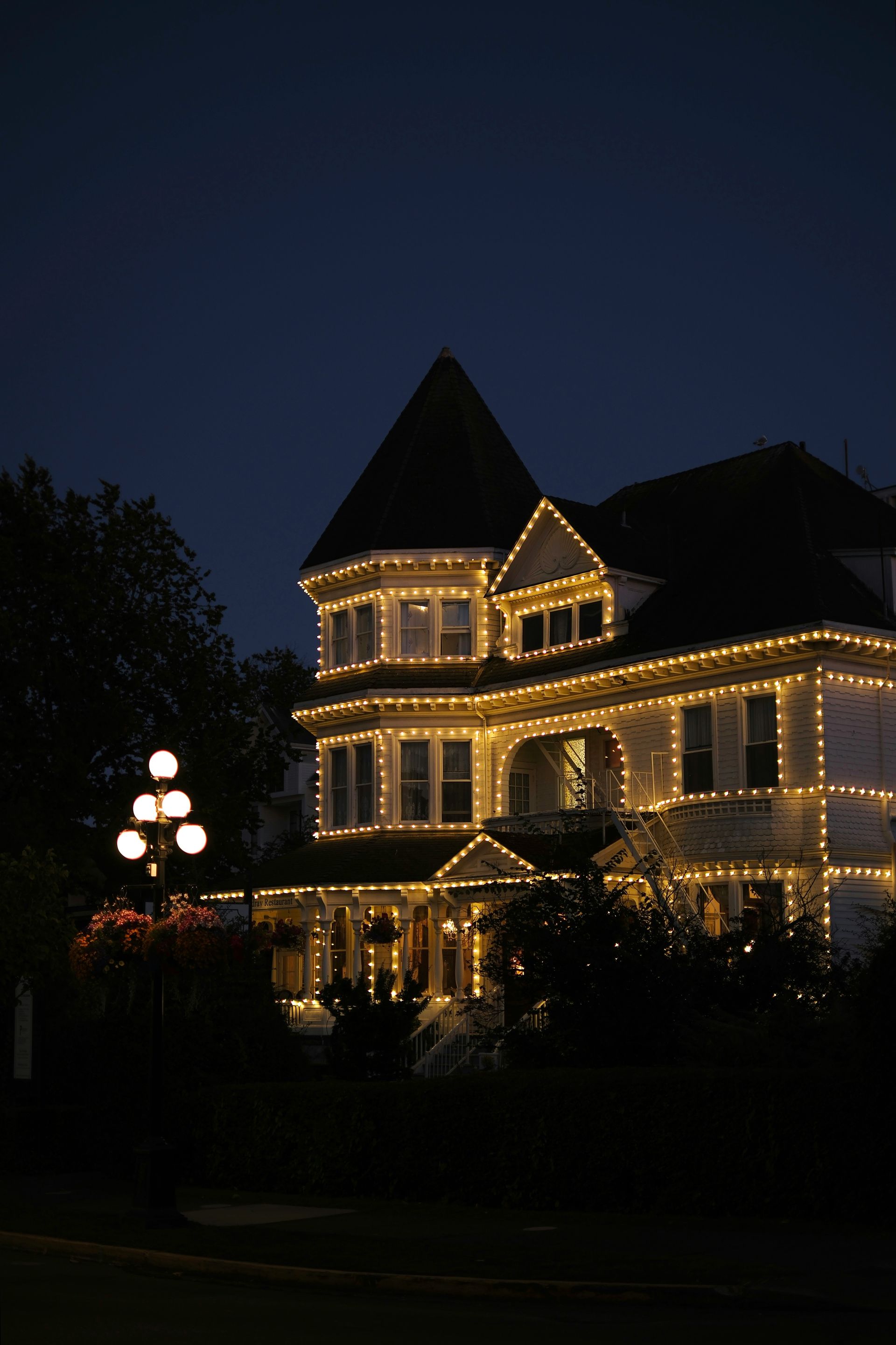 House adorned with lights at dusk